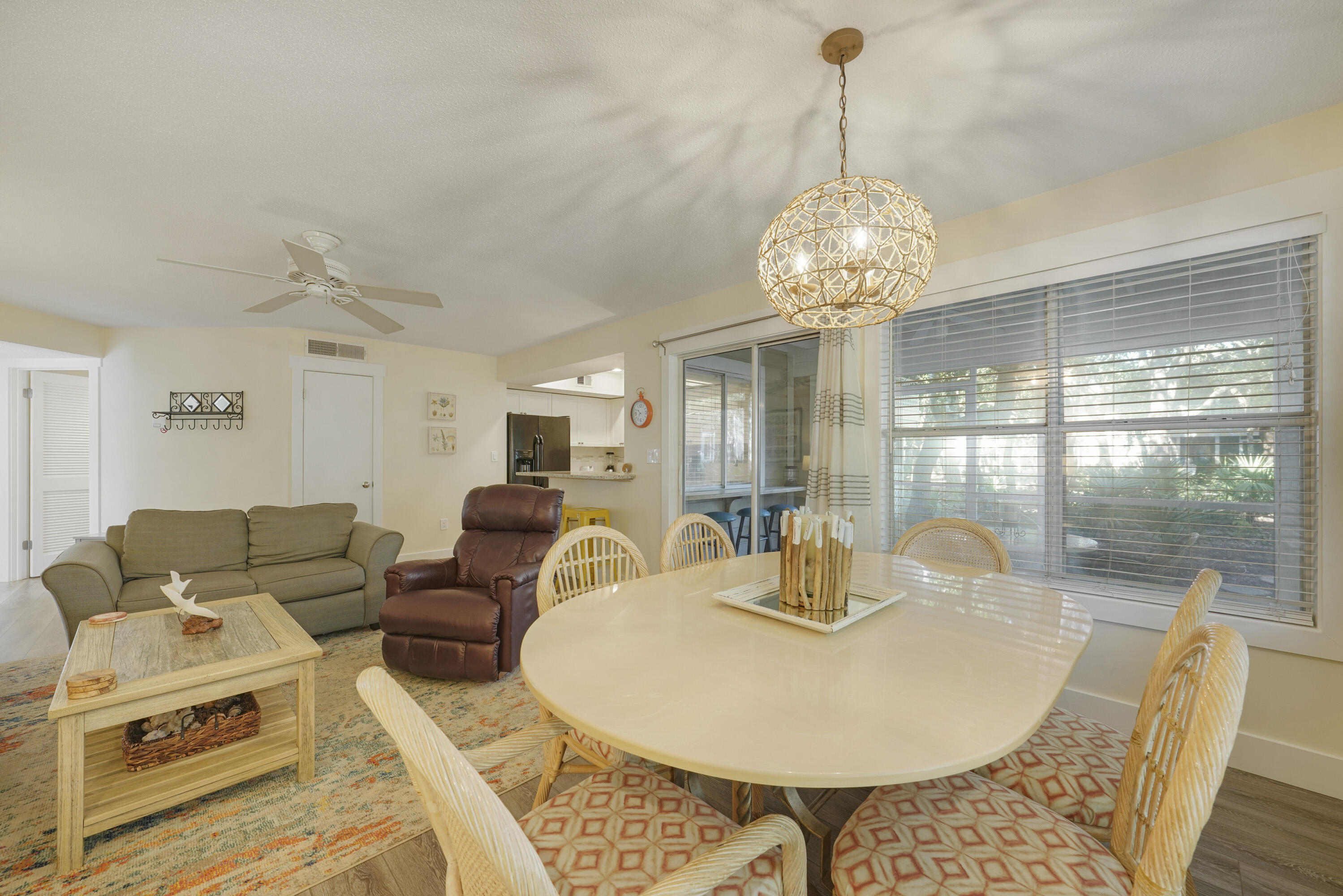 9815 Highway 98, Unit 200 Miramar Beach, FL 32550 - Photo 4 of 54 a dining room with furniture a chandelier and window