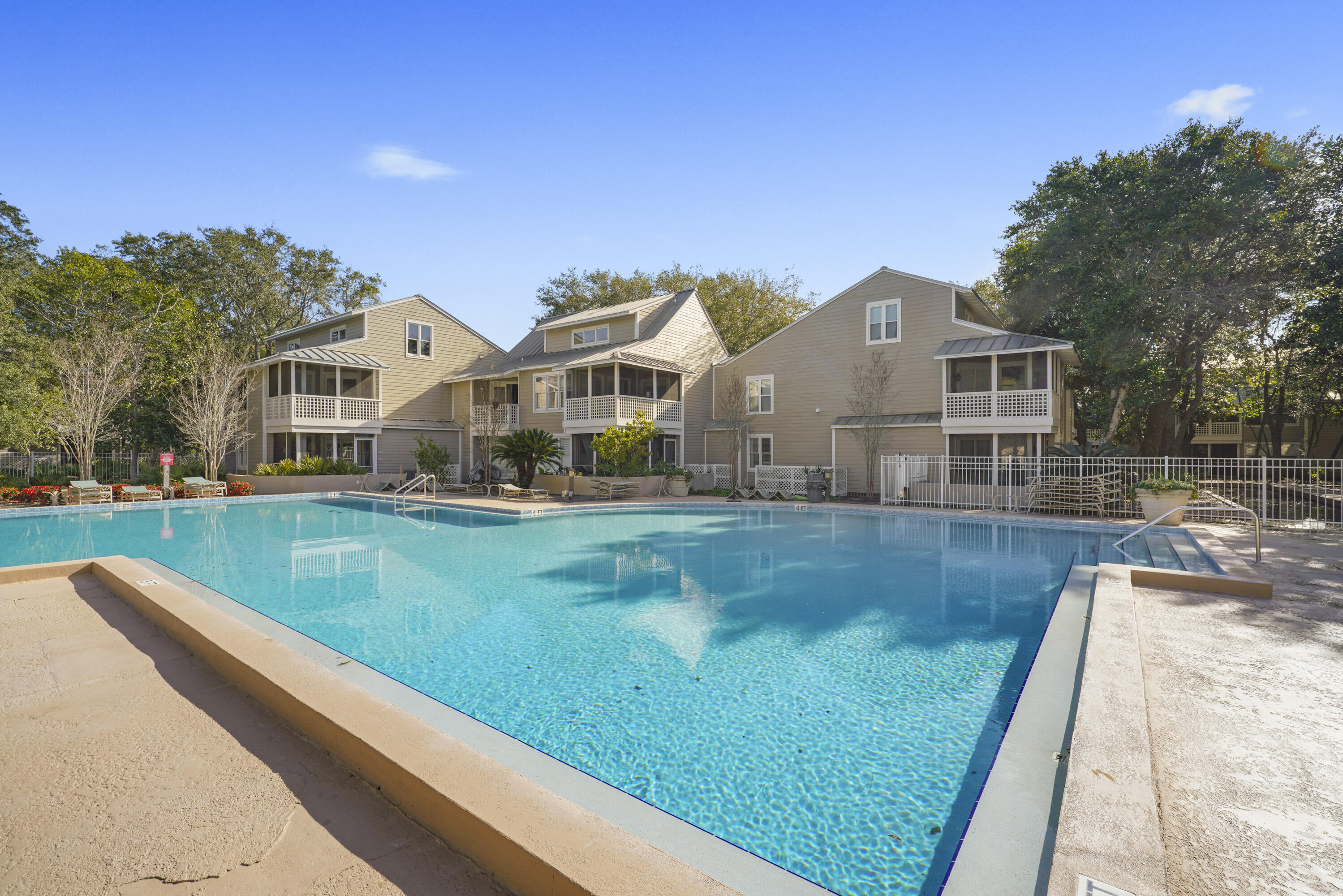 9815 Highway 98, Unit 200 Miramar Beach, FL 32550 - Photo 41 of 54 a front view of a house with garden