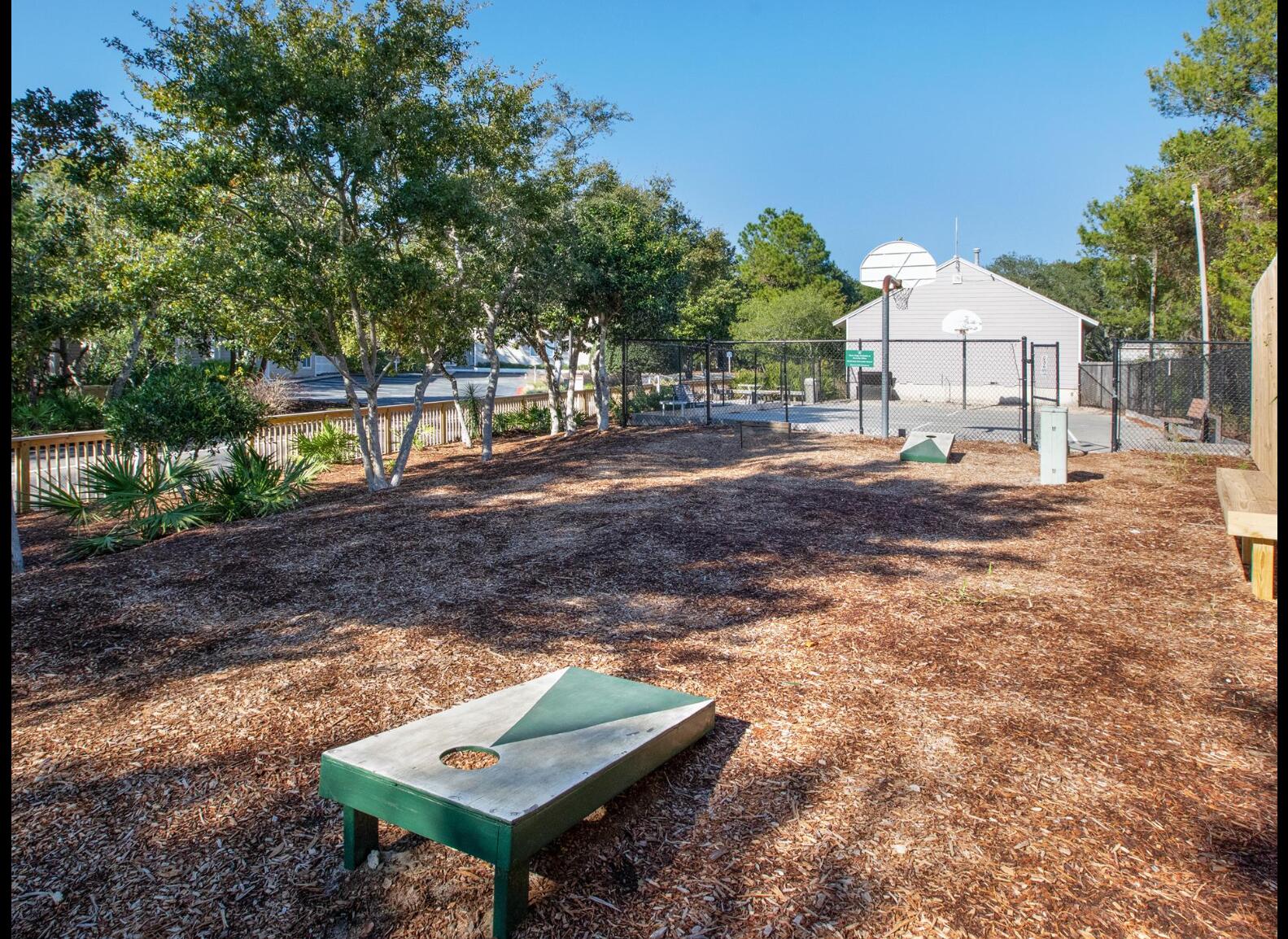 9815 Highway 98, Unit 200 Miramar Beach, FL 32550 - Photo 49 of 54 a view of a small yard with wooden fence