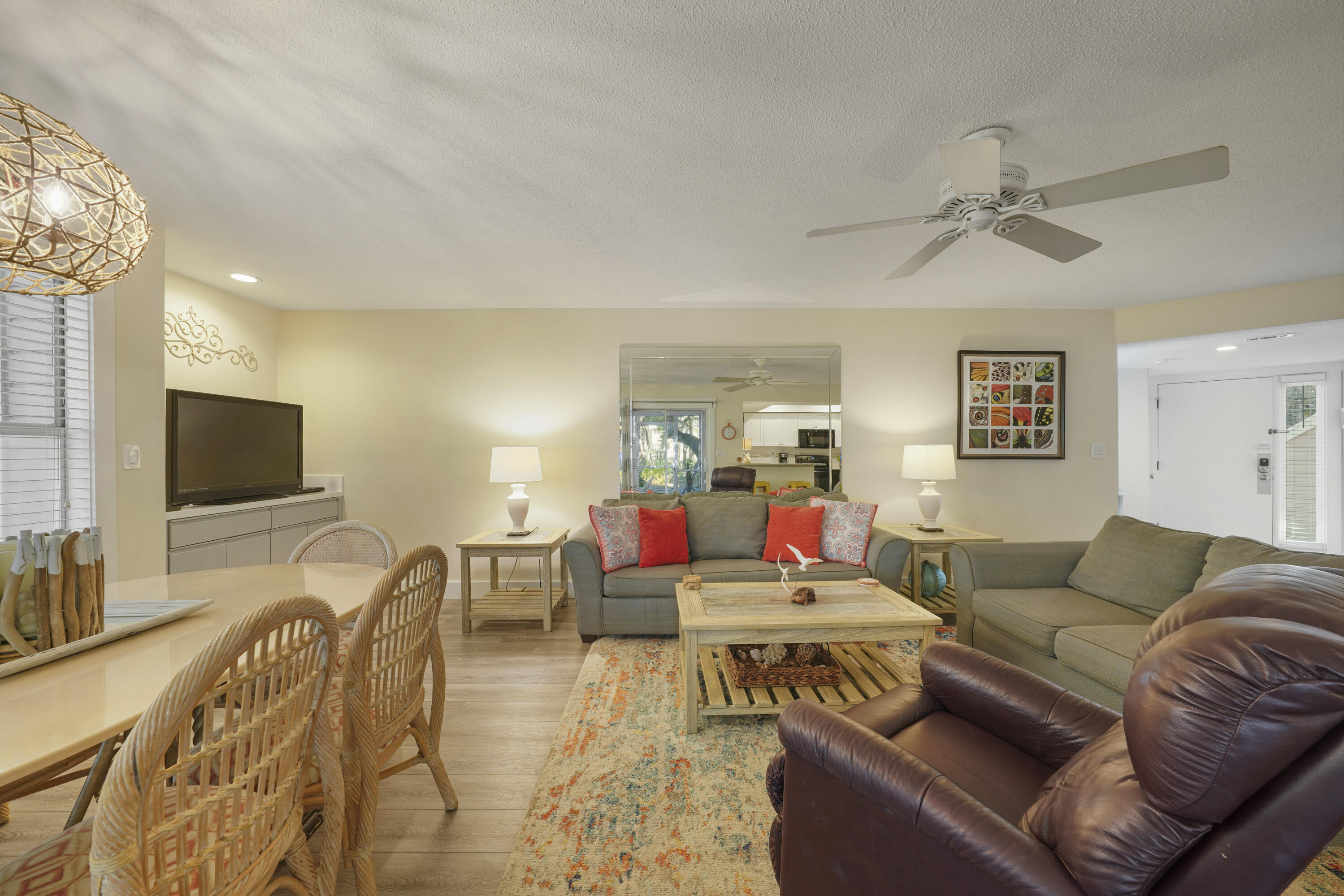 9815 Highway 98, Unit 200 Miramar Beach, FL 32550 - Photo 6 of 54 a living room with furniture and a flat screen tv