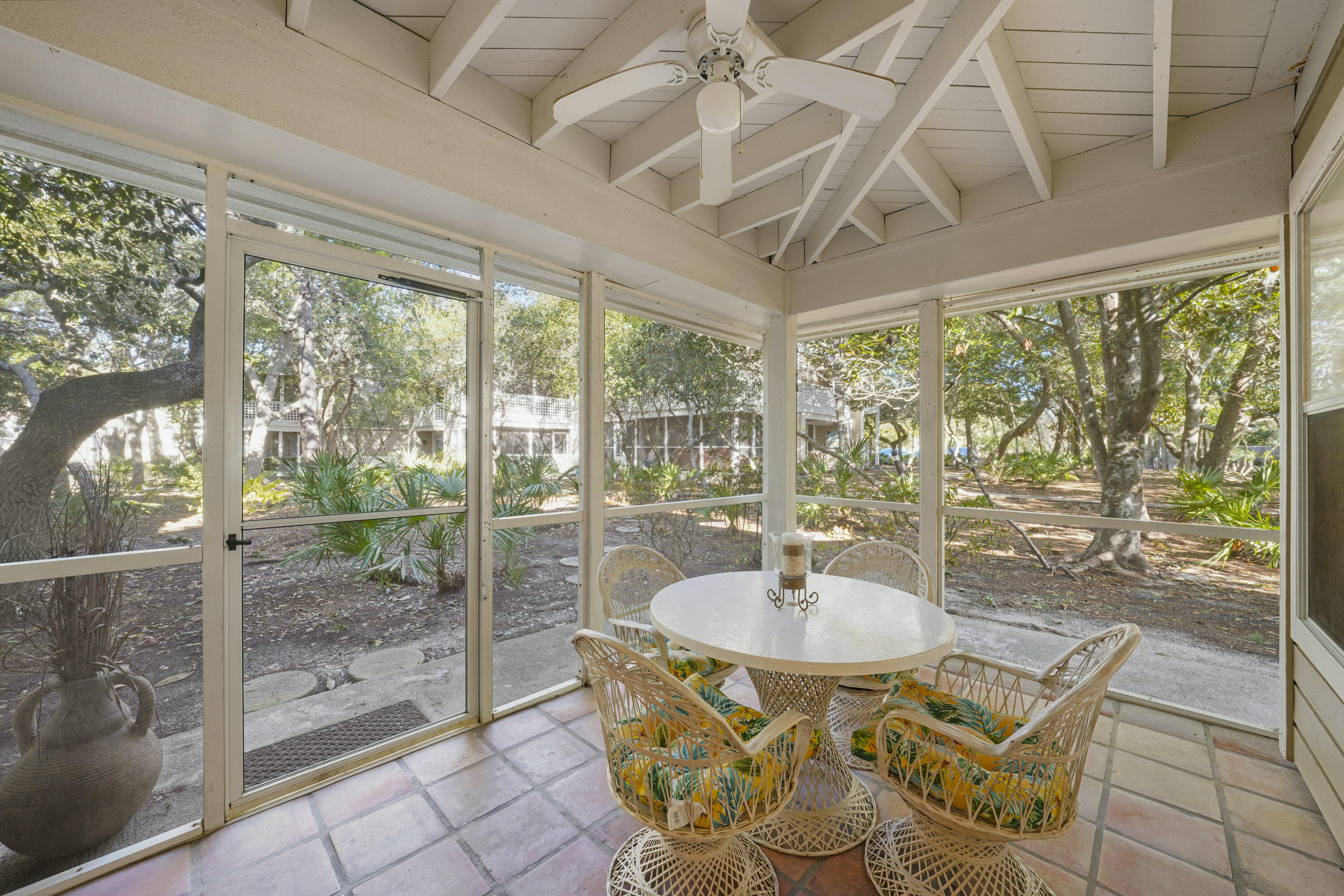9815 Highway 98, Unit 200 Miramar Beach, FL 32550 - Photo 10 of 54 a dining room with glass door and glass windows