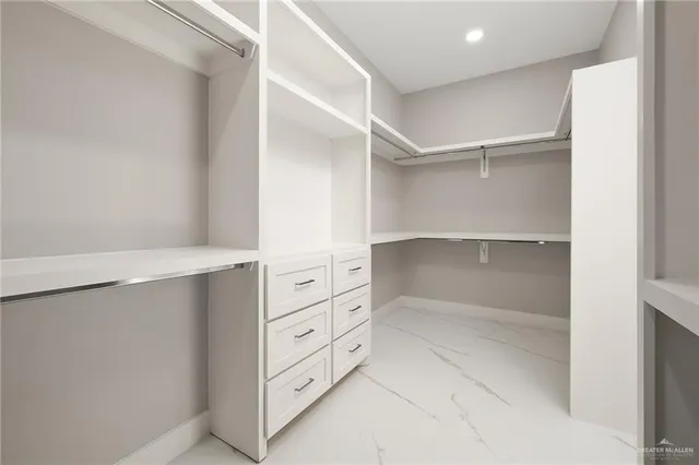 a view of an empty walk in closet