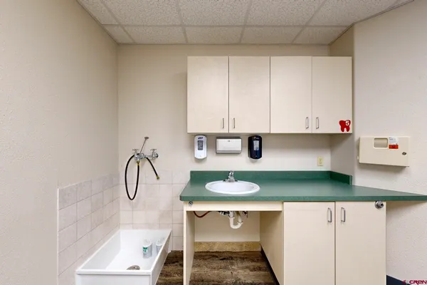 a kitchen with a table and cabinets