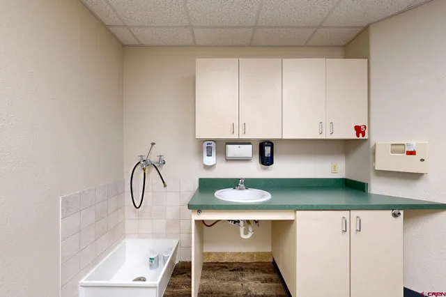 a kitchen with a table and cabinets