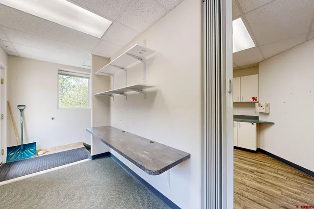 a view of a room with wooden floor and staircase
