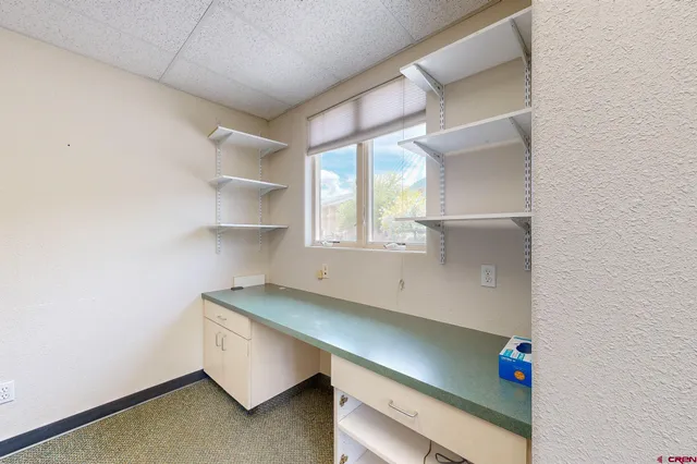 a room with a table and a window