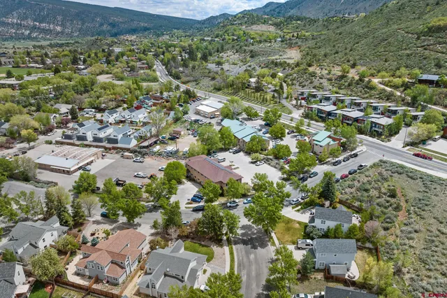 an aerial view of residential houses with outdoor space