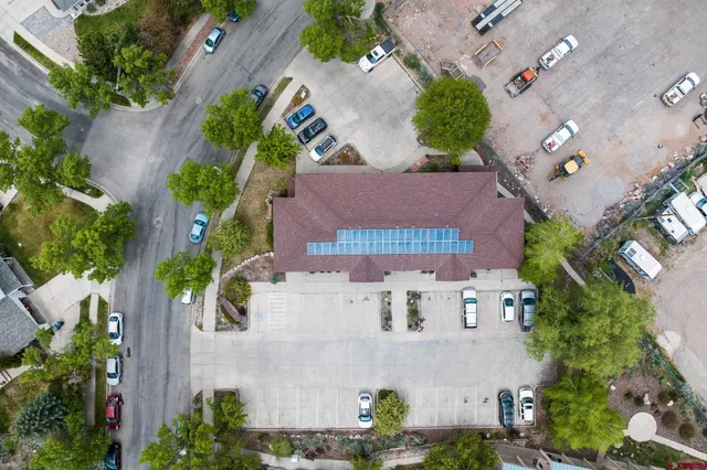an aerial view of residential houses with outdoor space
