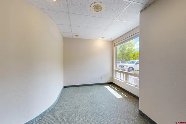 a view of an empty room with a window