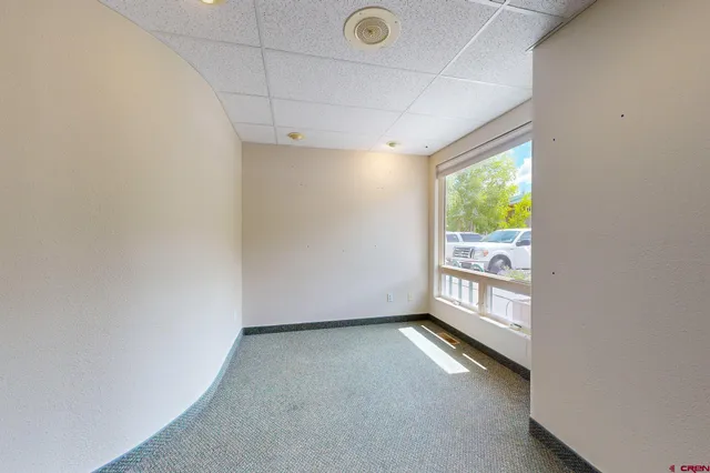 a view of an empty room with a window