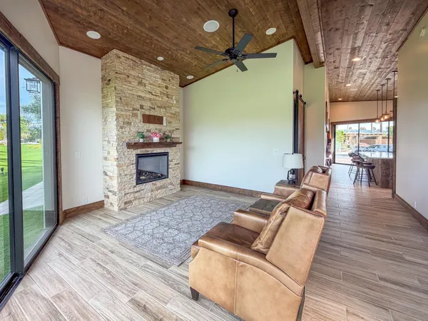 a living room with furniture and a fireplace
