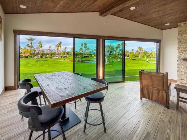 a view of a dining room with furniture window and outside view