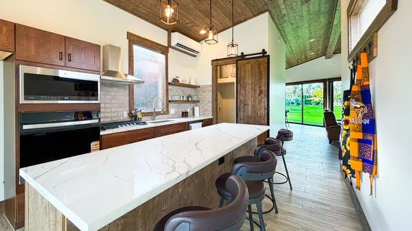 a very nice looking dining room with a large kitchen island