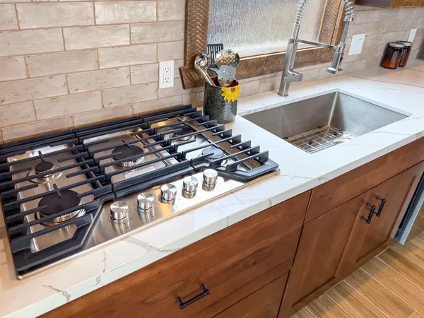 a kitchen with a stove and a sink