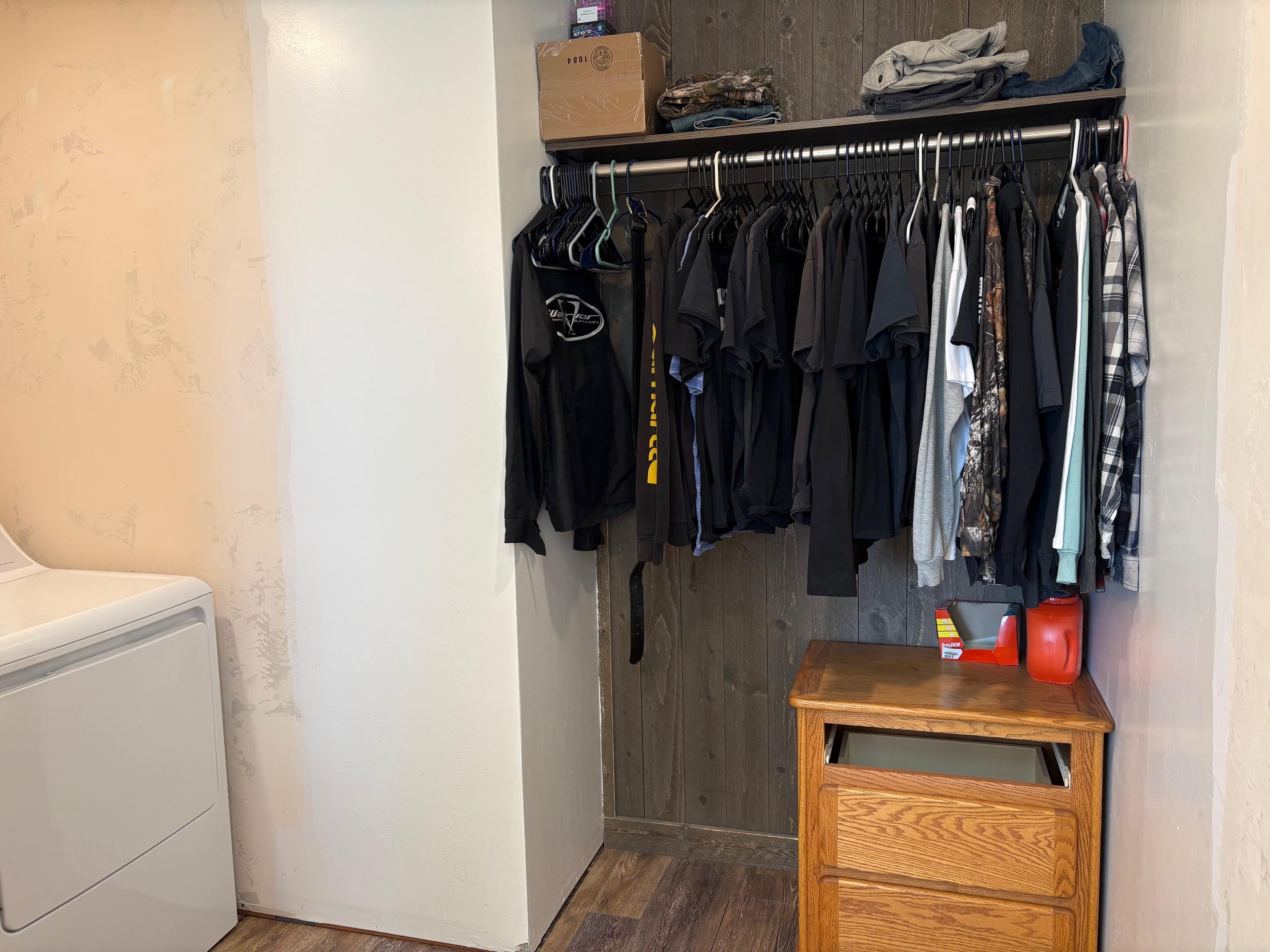 24500 Timothy Road Cedaredge, CO 81413 - Photo 13 of 33 a view of walk in closet with clothes and shoes