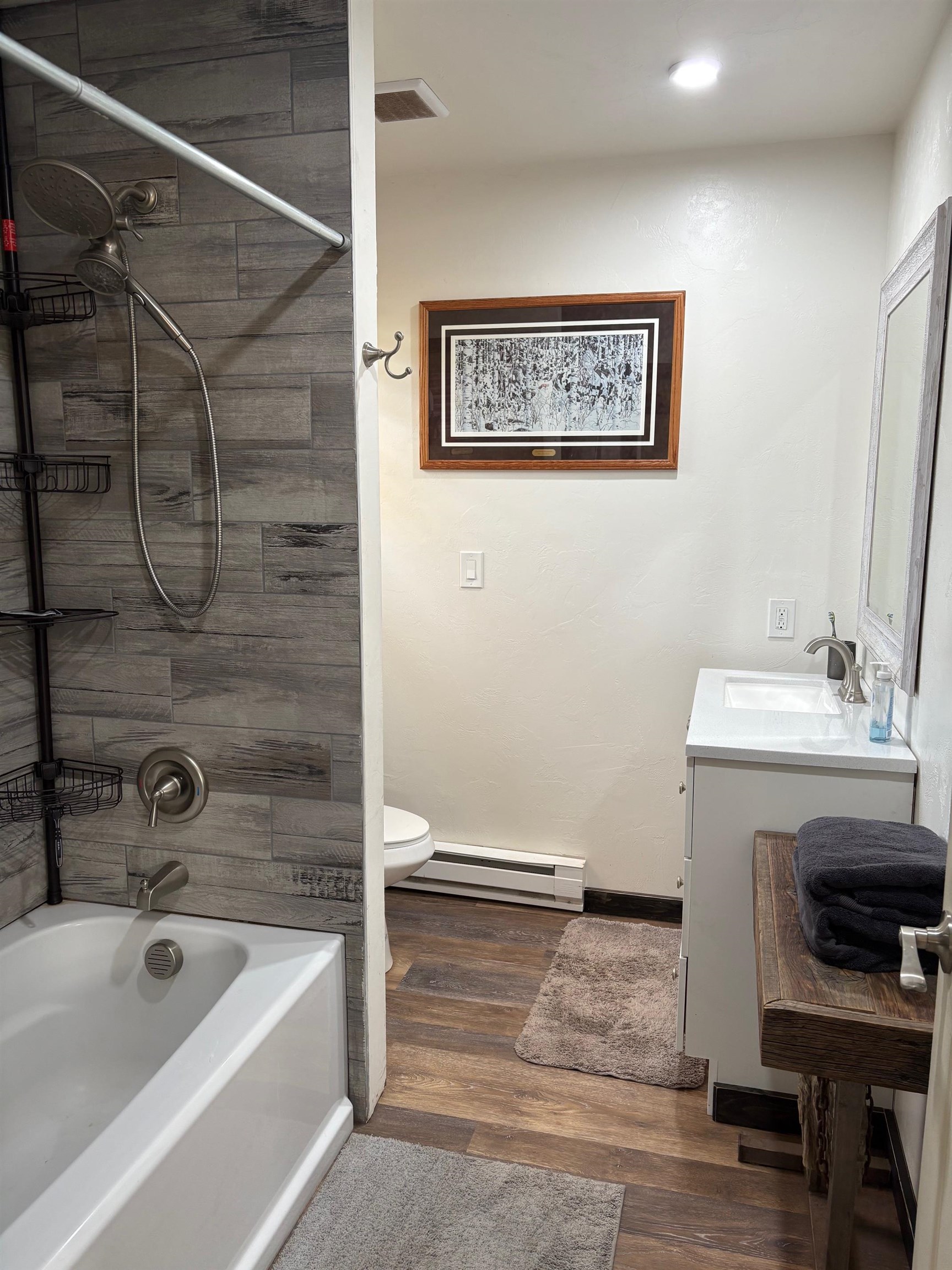 24500 Timothy Road Cedaredge, CO 81413 - Photo 15 of 33 a bathroom with a tub a sink and a shower