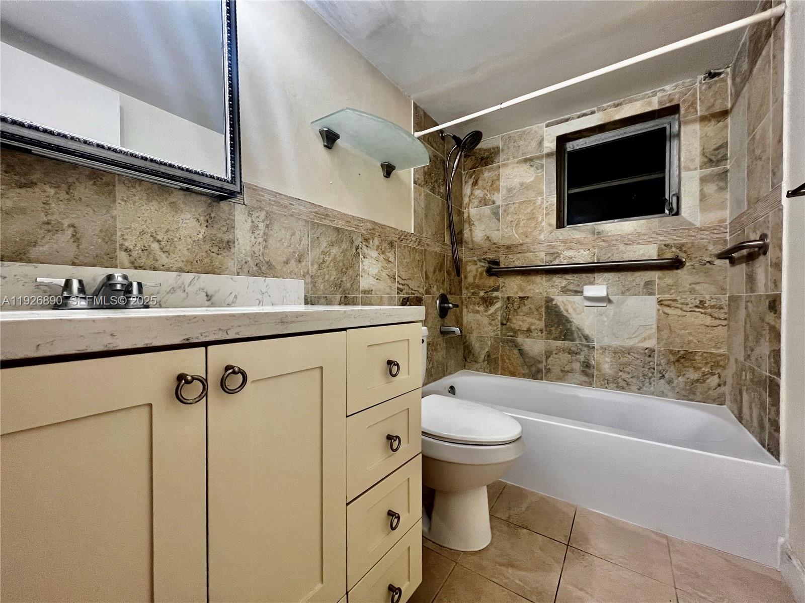 424 Southwest 7th Street, Unit 402 Miami, FL 33130 - Photo 5 of 11 a bathroom with a sink toilet and shower