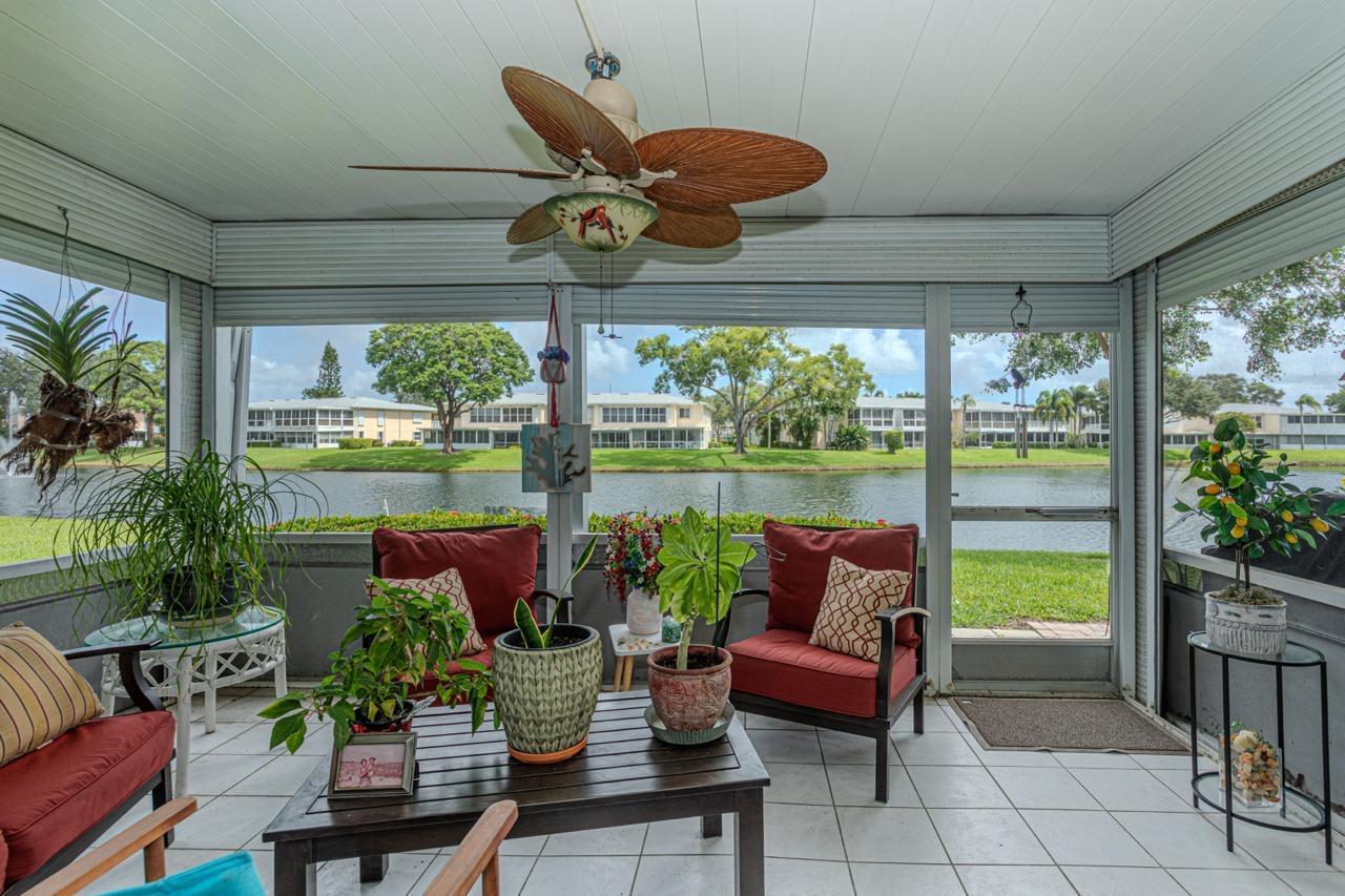 1421 Northwest 19th Terrace, Unit 102 Delray Beach, FL 33445 - Photo 18 of 31 a roof deck with couches and potted plants