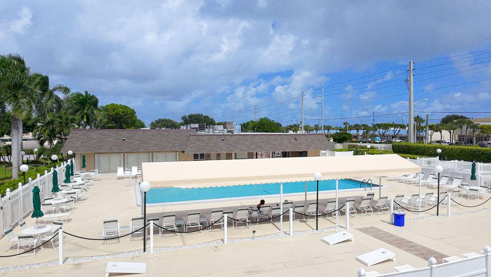 1421 Northwest 19th Terrace, Unit 102 Delray Beach, FL 33445 - Photo 30 of 31 a view of an outdoor space with seating area