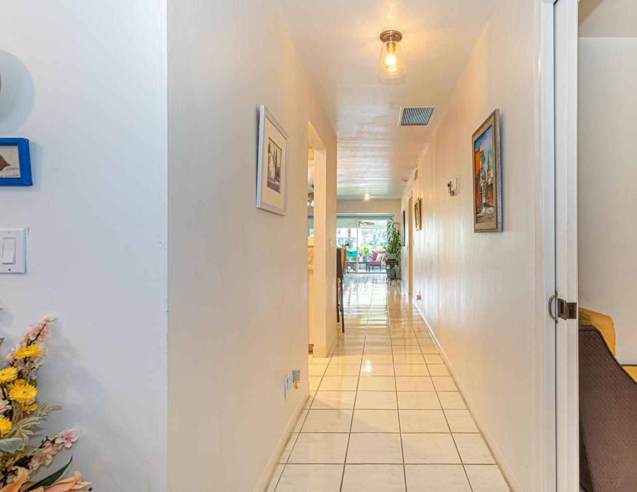1421 Northwest 19th Terrace, Unit 102 Delray Beach, FL 33445 - Photo 3 of 31 a view of a hallway