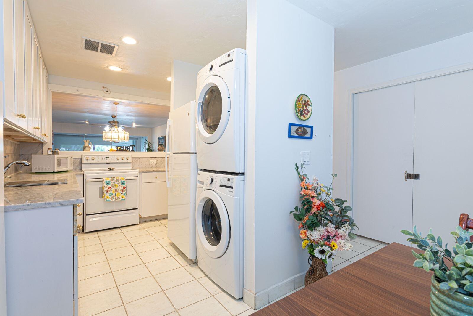 1421 Northwest 19th Terrace, Unit 102 Delray Beach, FL 33445 - Photo 6 of 31 a utility room with dryer and washer