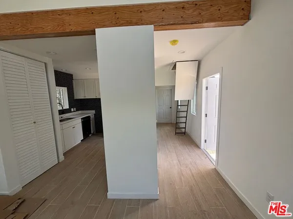 a view of a kitchen from the hallway