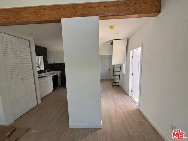 a view of a kitchen from the hallway
