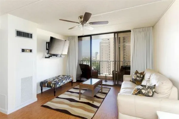 a living room with furniture and a flat screen tv