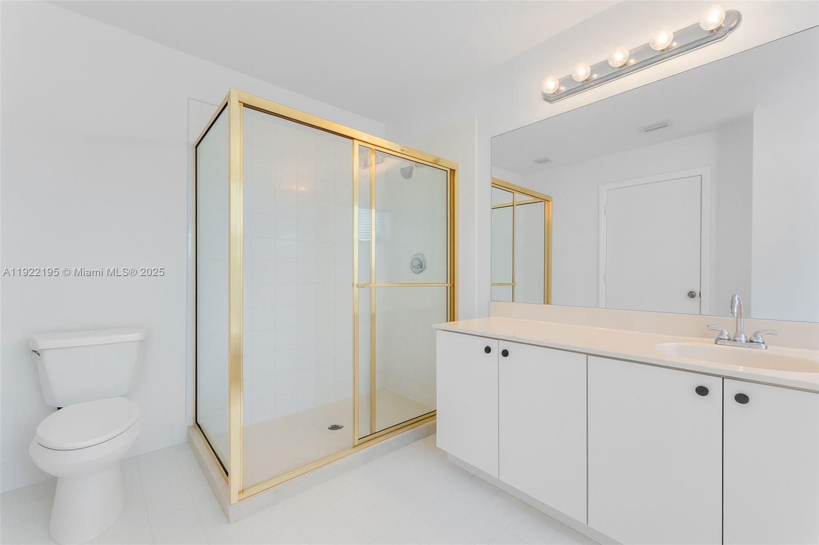 15854 Southwest 21st Street Miramar, FL 33027 - Photo 14 of 23 a spacious bathroom with a granite countertop sink a toilet and a mirror