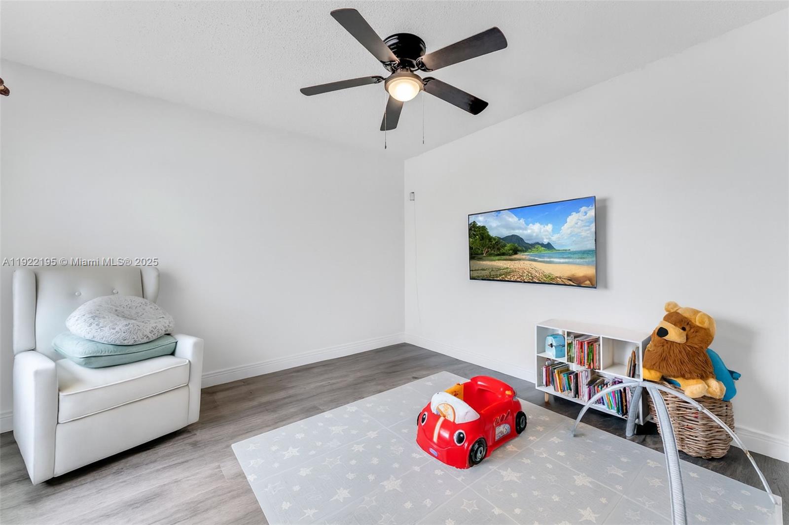 15854 Southwest 21st Street Miramar, FL 33027 - Photo 16 of 23 a bedroom with furniture and a lamp