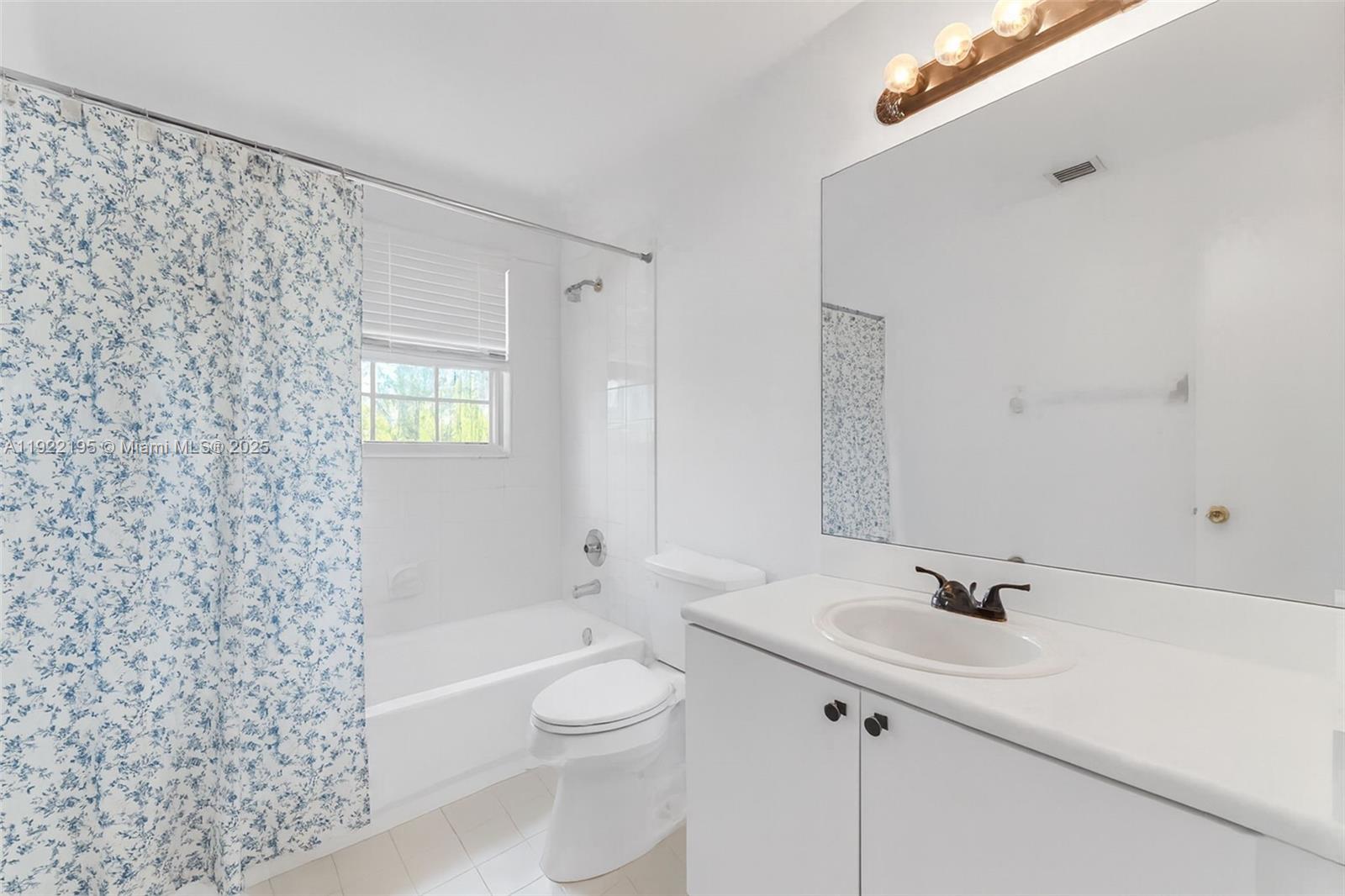 15854 Southwest 21st Street Miramar, FL 33027 - Photo 17 of 23 a bathroom with a sink a toilet and shower