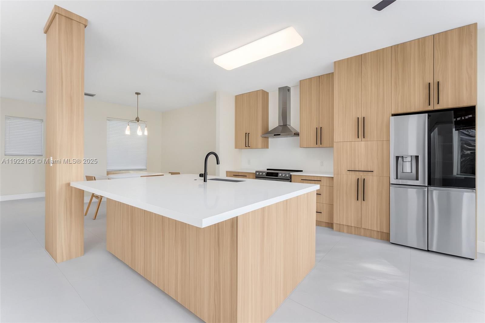 15854 Southwest 21st Street Miramar, FL 33027 - Photo 6 of 23 a kitchen with stainless steel appliances a sink stove and refrigerator