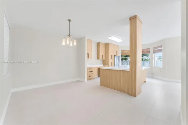 a view of a kitchen with a refrigerator a sink and dishwasher