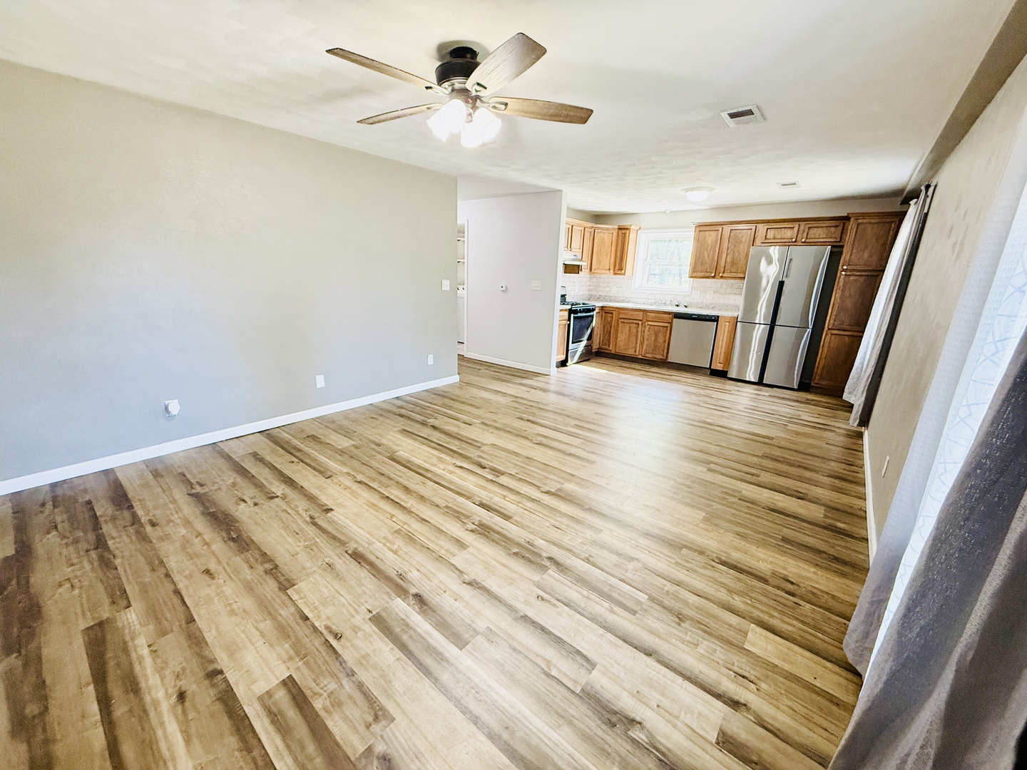 715 8th Street Colona, IL 61241 - Photo 2 of 14 a view of an empty room with a window