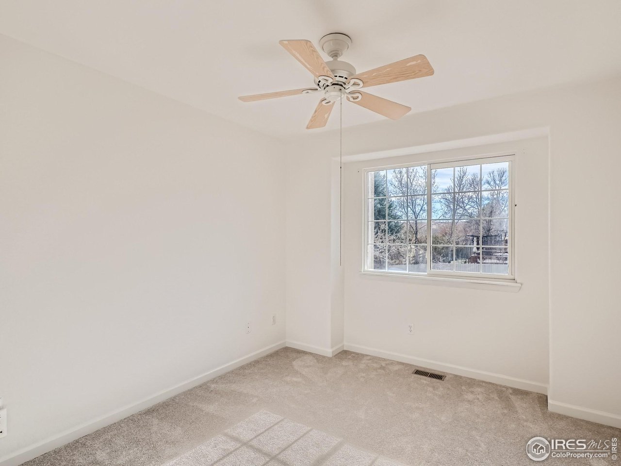 1285 Eldorado Drive Superior, CO 80027 - Photo 17 of 29 an empty room with windows and fan