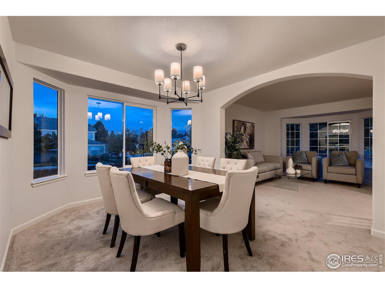 1285 Eldorado Drive Superior, CO 80027 - Photo 25 of 29 a dining room with furniture a chandelier and wooden floor