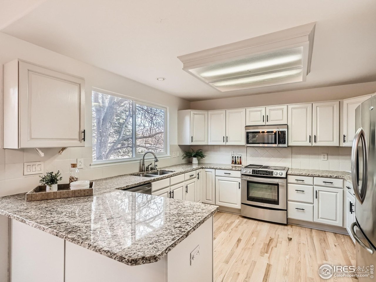1285 Eldorado Drive Superior, CO 80027 - Photo 7 of 29 a kitchen with stainless steel appliances granite countertop a sink stove and cabinets