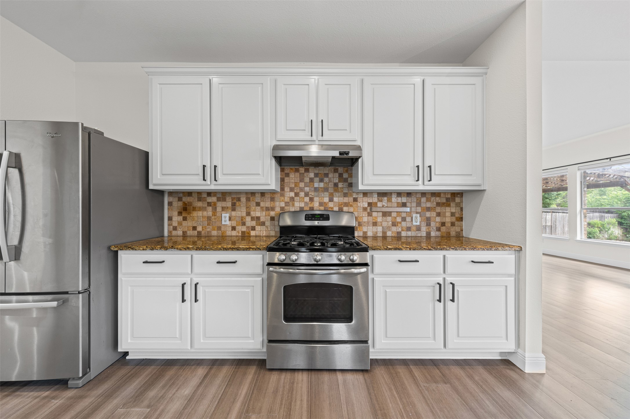 8820 Colberg Drive Austin, TX 78749 - Photo 11 of 35 A well-appointed kitchen showcasing contemporary stainless steel appliances and ample cabinetry.