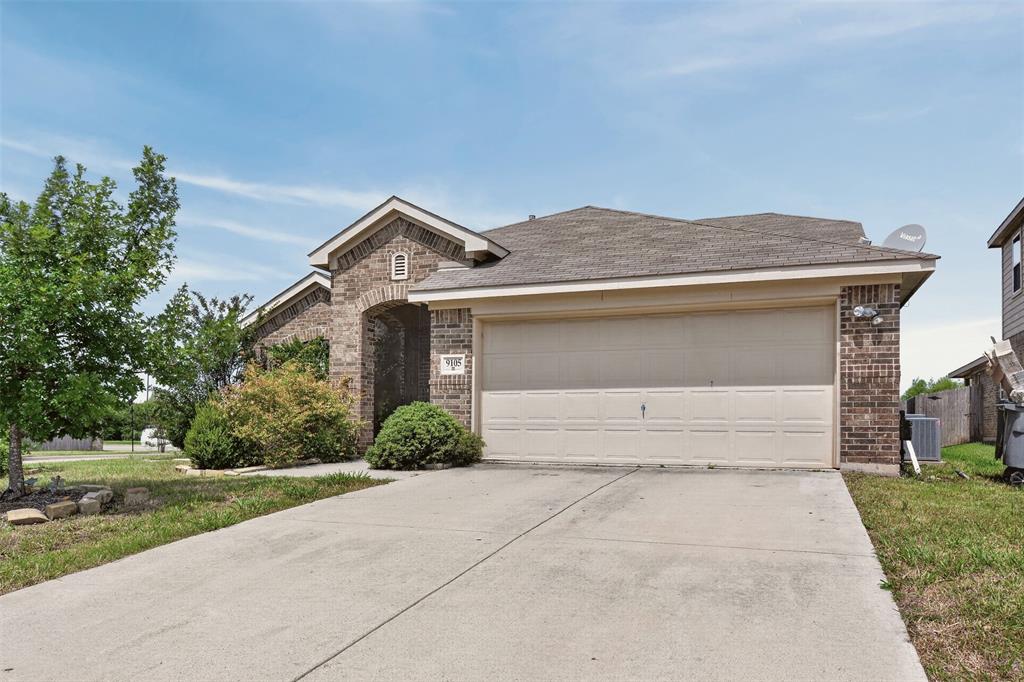 9105 Switchgrass Lane Forney, TX 75126 - Photo 1 of 20 Brick facade residence featuring an attached two-car garage, concrete driveway, and mature landscaping