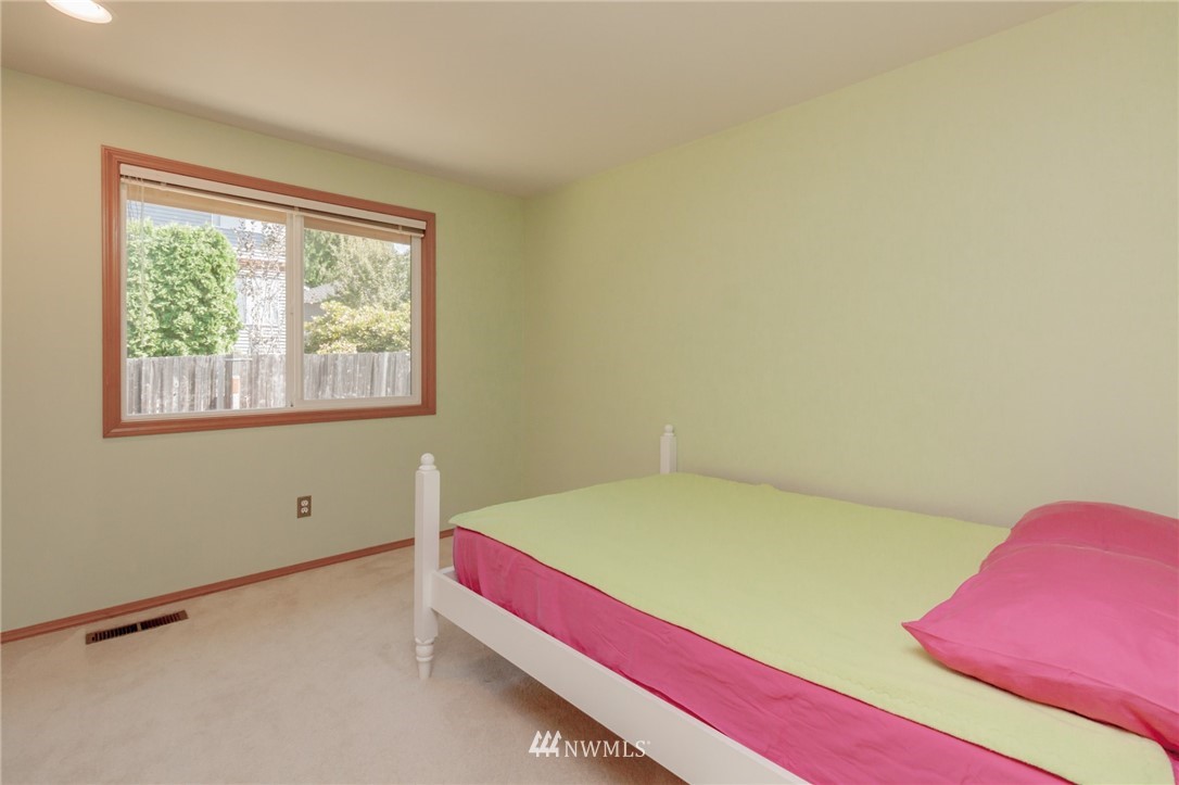 1822 Field Place Northeast Renton, WA 98059 - Photo 22 of 25 a room with a bed and a window