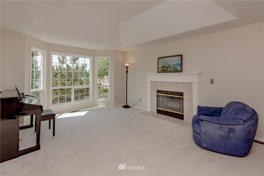 1822 Field Place Northeast Renton, WA 98059 - Photo 4 of 25 a living room with furniture and a fireplace