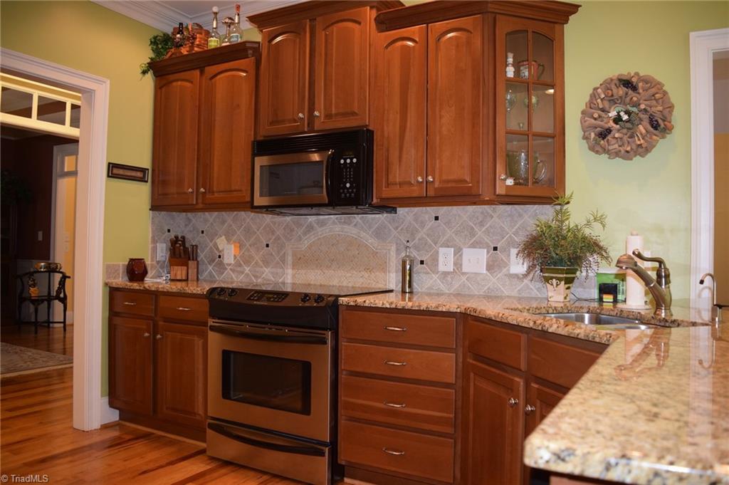 296 Canyon Road Mocksville, NC 27028 - Photo 9 of 30 Kitchen sink has separate water faucet for bottled water tank which also feeds both refrigerators and ice makers.