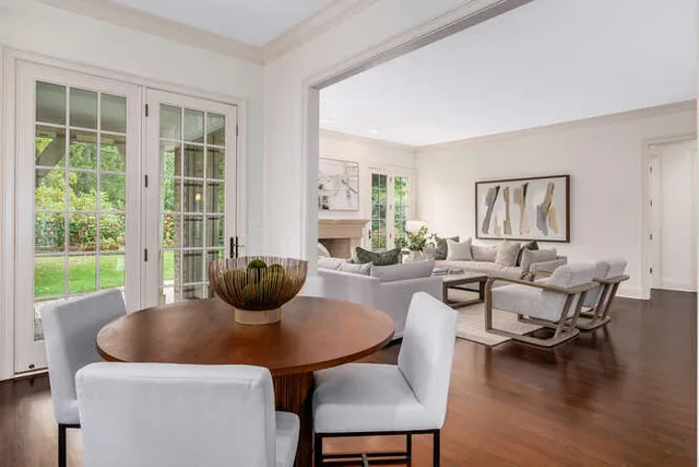 a view of a dining room with furniture and wooden floor