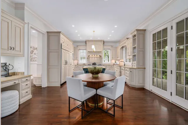 a dining room with furniture and wooden floor