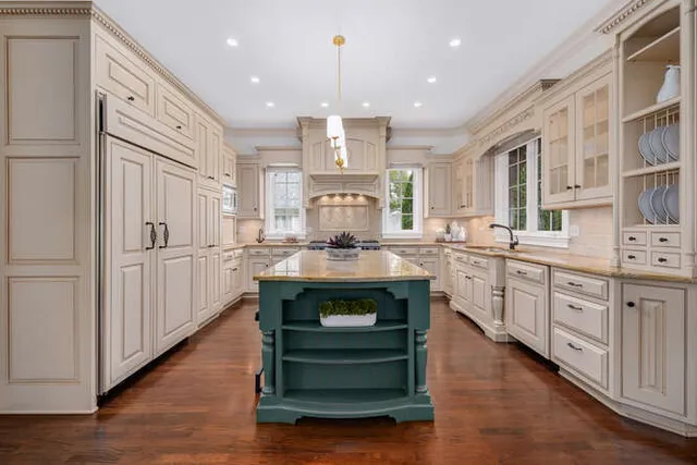 a kitchen with stainless steel appliances granite countertop a stove and a refrigerator