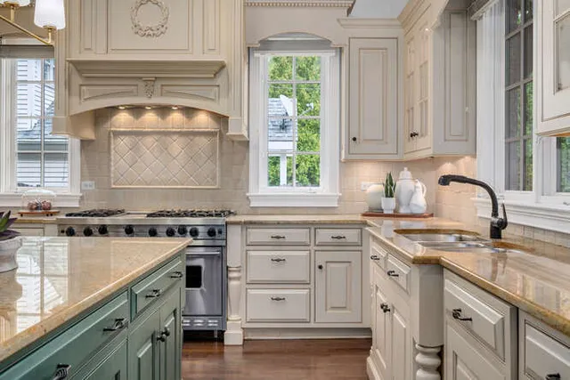 a kitchen with granite countertop a sink stove and cabinets