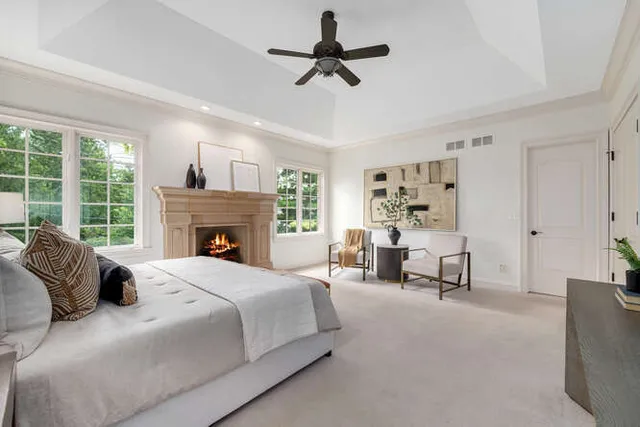 a bedroom with a bed and a fireplace