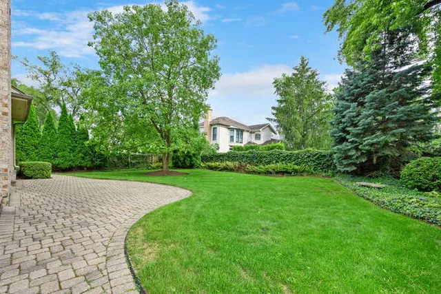 a view of a backyard of the house