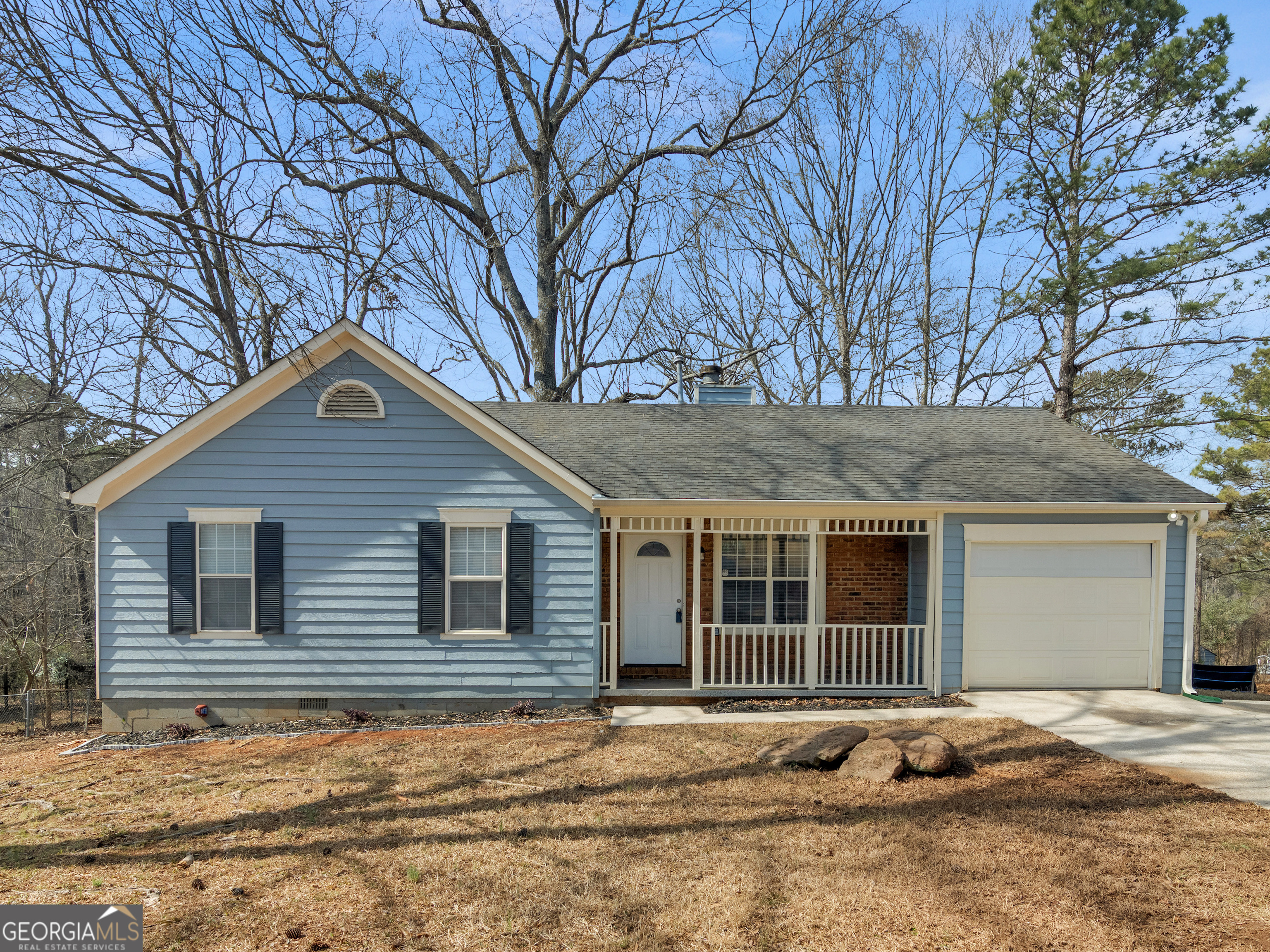 a house with trees in the background
