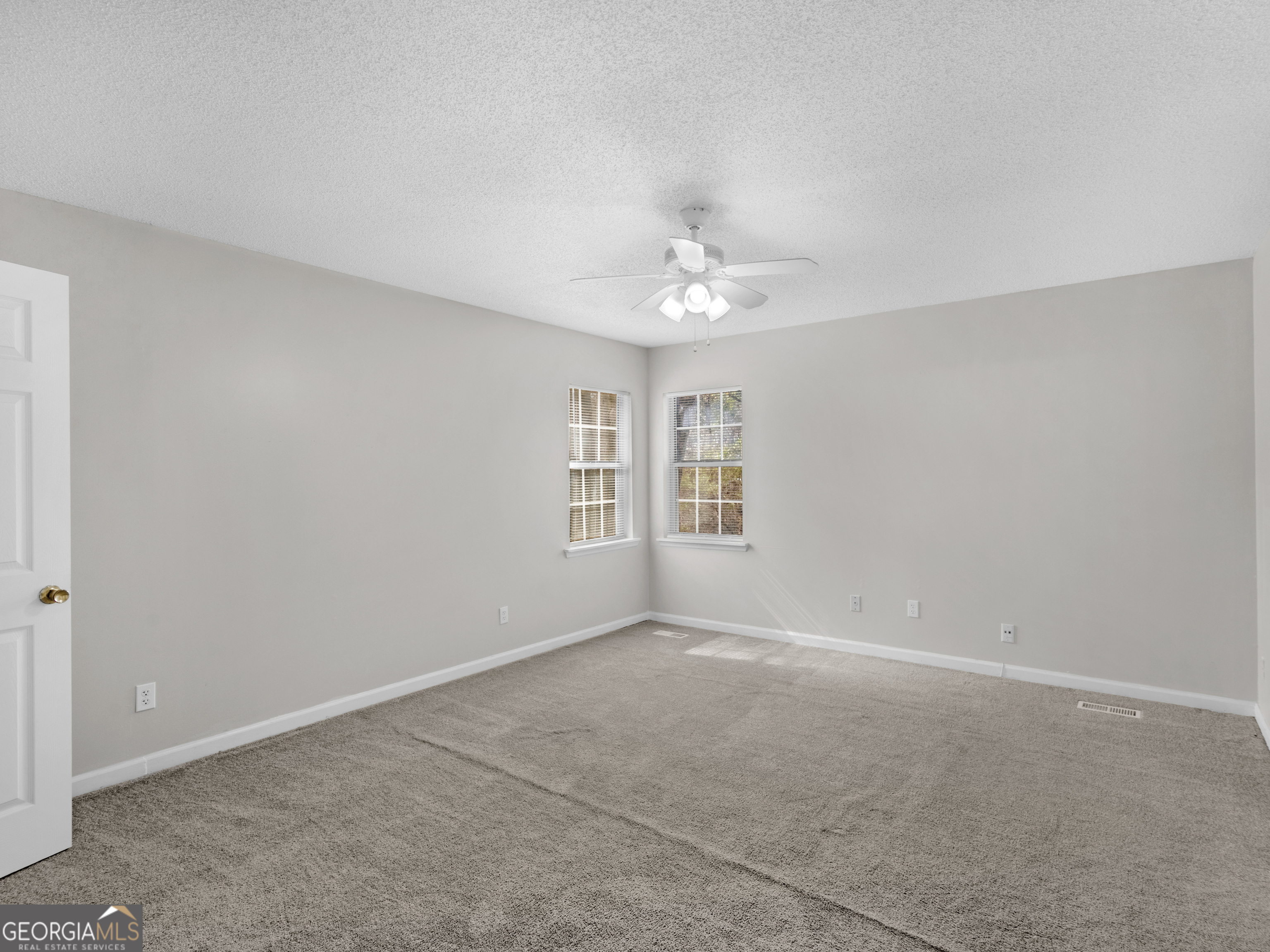 111 Neal Avenue Stockbridge, GA 30281 - Photo 19 of 27 a view of an empty room with a window